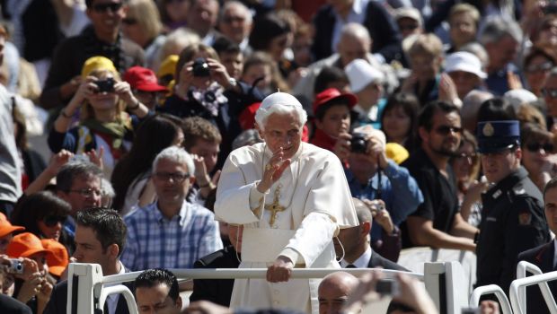 Pope Benedict XVI blesses faithful while touring St. Peter square during the weekly general audience at the Vatican, Wednesday, April 18, 2012. (AP Photo/Alessandra Tarantino)