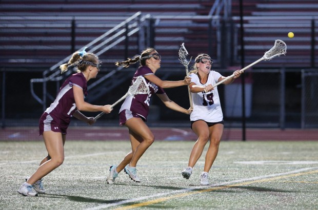 Radnor's Taylor Murphy passes the ball around Conestoga's Eva Stagnaro. (Tom Silknitter photo)