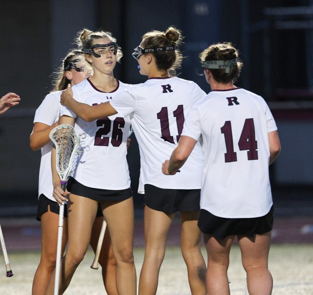 Radnor's Marin Mooney (26) is congratulated by Cara Ruggieri (11) and Kate Gallagher (14 for Radnor's first goal. (Tom Silknitter photo)