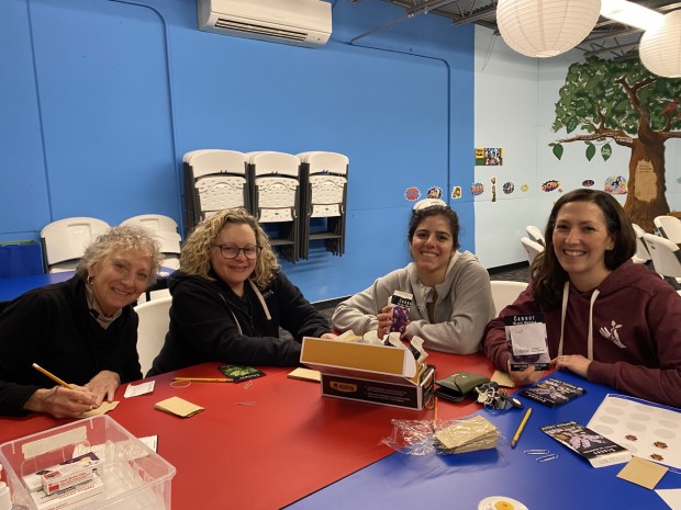 Members of Conshohocken Community Garden sort seeds. (Photo courtesy Holly Holst, CFL)