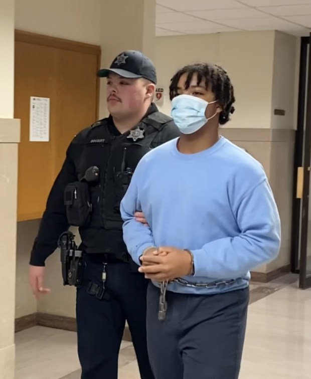 Justin Lyaire Davis, 16, is escorted by a deputy sheriff from his arraignment hearing on April 8, 2024, on robbery- and homicide-related charges in Montgomery County Court. (Photo by Carl Hessler Jr. - MediaNews Group)