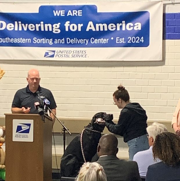 At the dog-bite awareness campaign kickoff last week at the Treddiffrin facility Dog Training Elite's Ed Erb and his assistant demonstrate responsible dog ownership. (COURTESY OF THE POSTAL SERVICE)