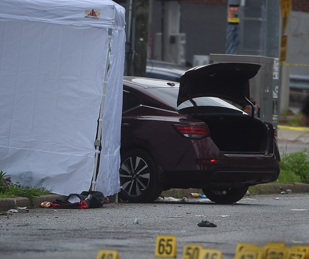 The deceased female was removed from this bullet ridden sedan. (PETE BANNAN-DAILY TIMES)