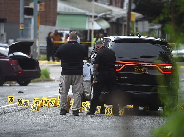 Police document numerous shell casings on Tuesday in Chester near where the woman was fatally shot. (PETE BANNAN-DAILY TIMES)