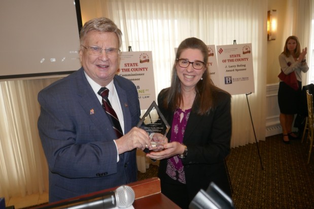 Former Chester County Commissioner and state Senator Earl Baker presents Jeanne Franklin with the J. Larry Boling Award.