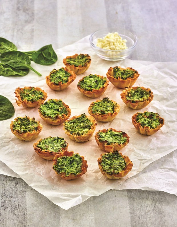 Spinach and Feta Phyllo Cups: A creamy savory spinach filling meets a flaky phyllo shell in this simple and portable appetizer. (Photo by James Stefiuk)