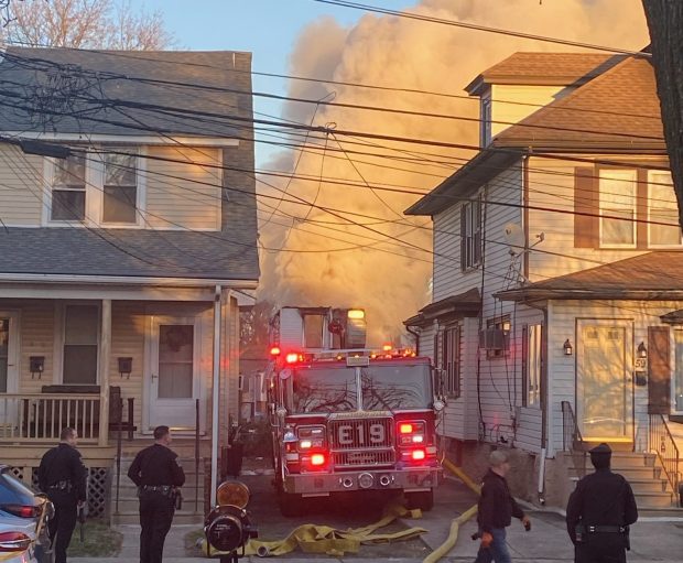 Police and firefighters at the scene Wednesday in east Lansdowne. (PETE BANNAN -DAILY TIMES)