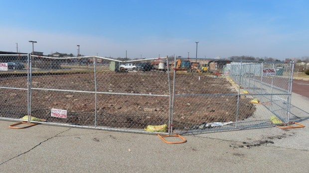 Chain link fencing surrounding a construction site.