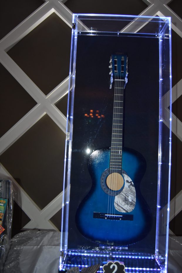 One of the silent auction items at the Bancroft Butterfly Ball was an Acoustic Guitar featuring Autograph by Taylor Swift. (Photo by Maggie Corcoran)