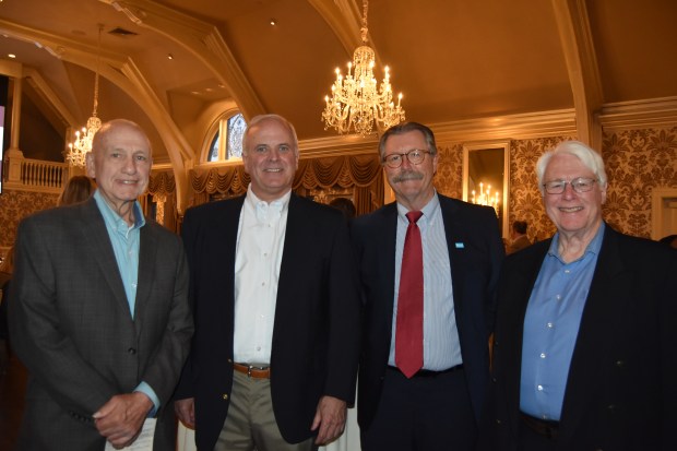 Paul Rihn, Habitat for Humanity site supervisor, Steven Kopenhaver, Habitat for Humanity board officer, Keith Sterling, CEO of Habitat for Humanity of Montgomery and Delaware Counties and Gene Wayne, Habitat for Humanity project manager. (Photo by Maggie Corcoran)