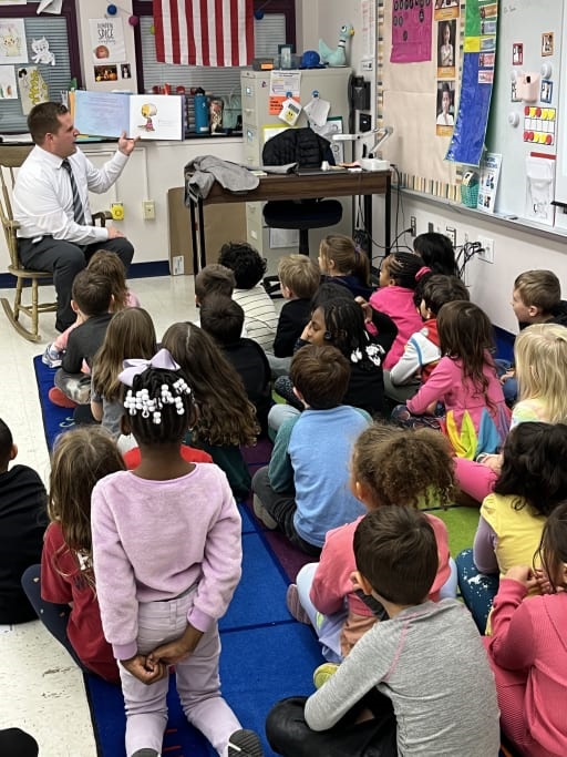 Lower Merion School District Superintendent Dr. Steven Yanni reads to kindergarten students at Penn Wynne Elementary School in Nov. 2023. (Photo courtesy of LMSD)