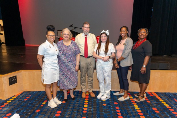 Dr. Stuart K. and Sandra H. Fine provided a generous gift to the Montgomery County Community College Foundation, establishing an endowed innovation fund to enhance MCCC's nursing program in perpetuity as well as creating endowed student scholarships to support the advancement of healthcare education for future generations. From left: Cachae Pearson Smith, student co-chair of the nursing pinning ceremony; Sandra H. Fine; Dr. Stuart K. Fine; Leslie Pezzano, student co-chair of the nursing pinning ceremony; Dr. Chae Sweet, Vice President of Academic Affairs and Provost; and Dr. Tammi Britt, DNP, RN, Assistant Director of Nursing. Photo by Linda Johnson