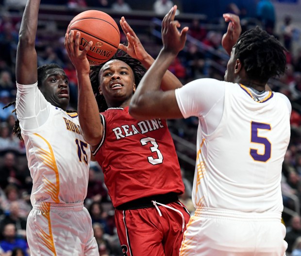 Reading High's Myles Grey drives against Roman Catholic in the Red Knights' 63-56 overtime win in the PIAA Class 6A Final Saturday in the Giant Center. (BILL UHRICH - READING EAGLE)