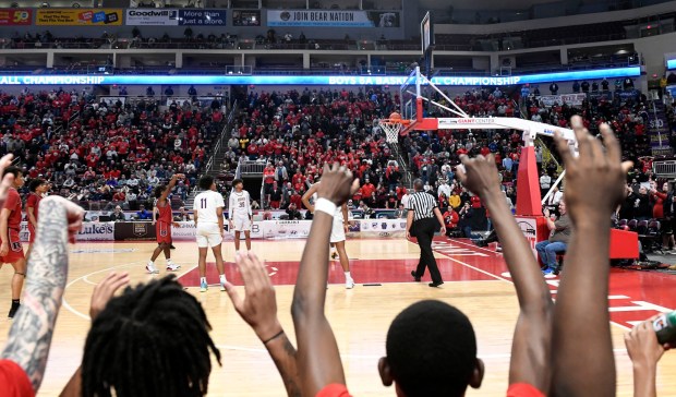 Reading High's Myles Grey makes a crucial pair of free throws the put the game away in overtime against Roman Catholic in the Red Knights' 63-56 victory in the PIAA Class 6A Final Saturday in the Giant Center. (BILL UHRICH - READING EAGLE)