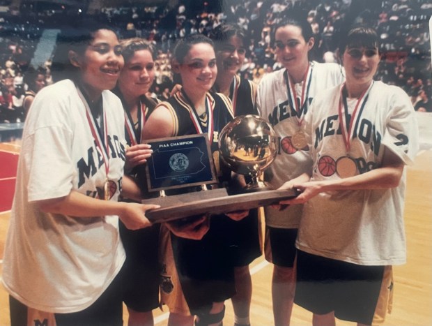 Shanette Lee (far left) holds the PIAA state basketball championship trophy with her Merion Mercy teammates after the Golden Bears captured the title in 1995. (Main Line Media News file)