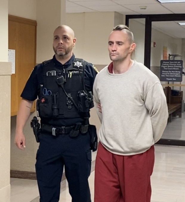 Kenneth Crisden Shea, 37, is escorted by a deputy sheriff from a Montgomery County courtroom on May 30, 2024, where he informed a judge he plans to plead guilty to charges he fatally stabbed his estranged wife in her Wyndmoor home. (Photo by Carl Hessler Jr. - MediaNews Group)