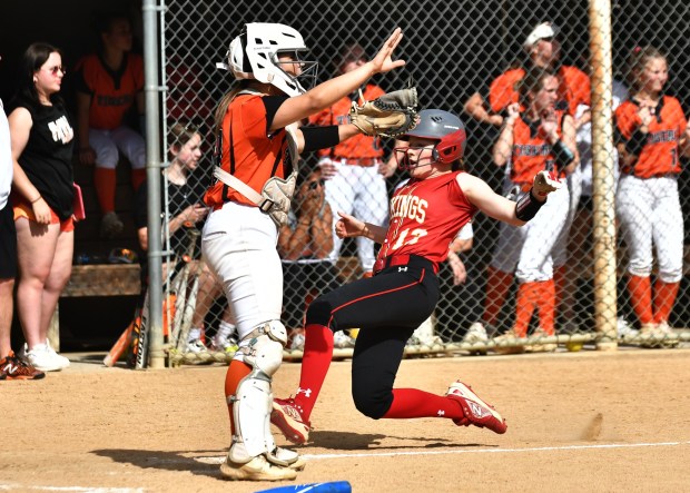 WC East's Emma Antczak scores behind Marple catcher Gace Corner (BILL RUDICK for MediaNews Group)