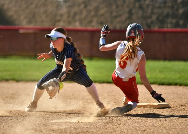 West Chester East's Ava Cross slides in with a stolen base as Unionville's Grace Levenas takes the throw (BILL RUDICK for MediaNews Group)