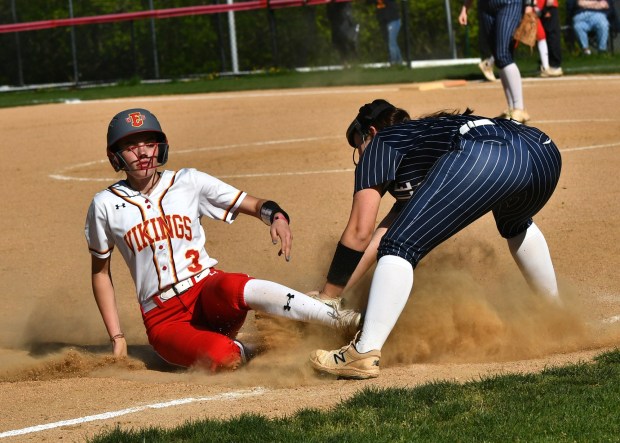 West Chester East's Grace Koberg slides in safely behind the tag of Unionville thirdbaseman Alexa Logan (BILL RUDICK for MediaNews Group)